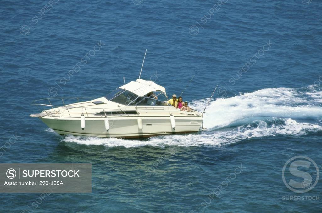 Stock Photo: 290-125A High angle view of three people in a speedboat