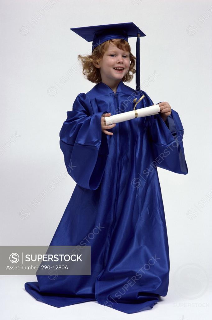 Stock Photo: 290-1280A Girl in a graduation gown holding a diploma