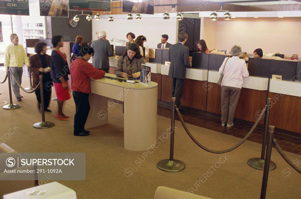Stock Photo: 291-1092A Bank employees with customers in a bank