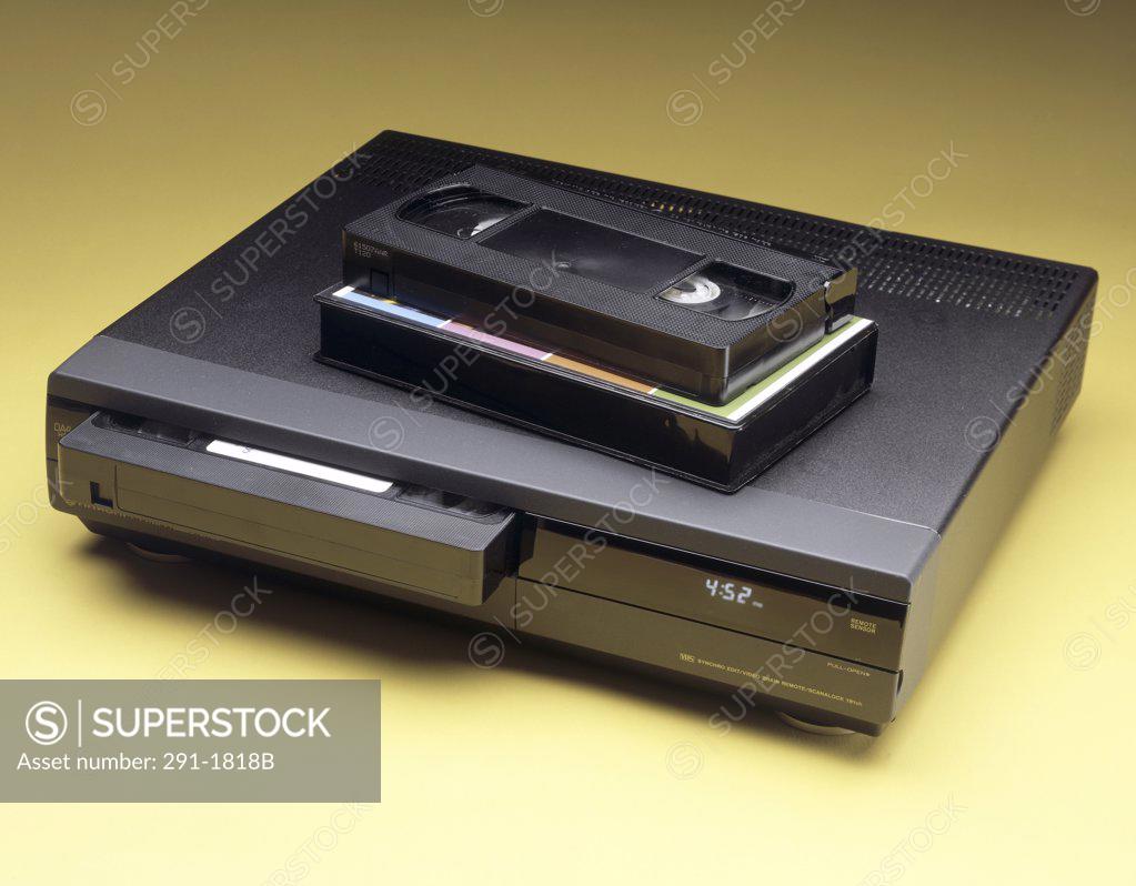 Stock Photo: 291-1818B Close-up of a VCR with two videocassettes