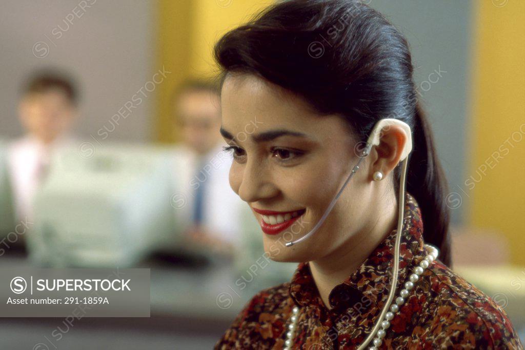 Stock Photo: 291-1859A Close-up of a businesswoman wearing a headset