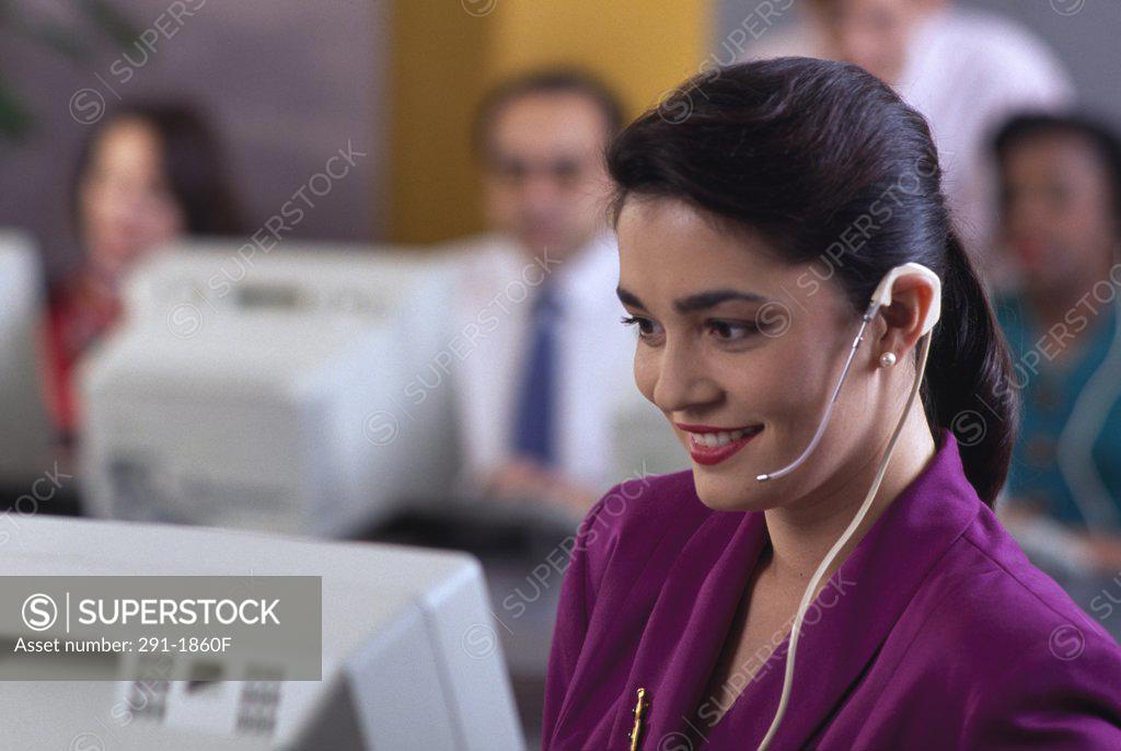 Stock Photo: 291-1860F Close-up of a businesswoman wearing a headset