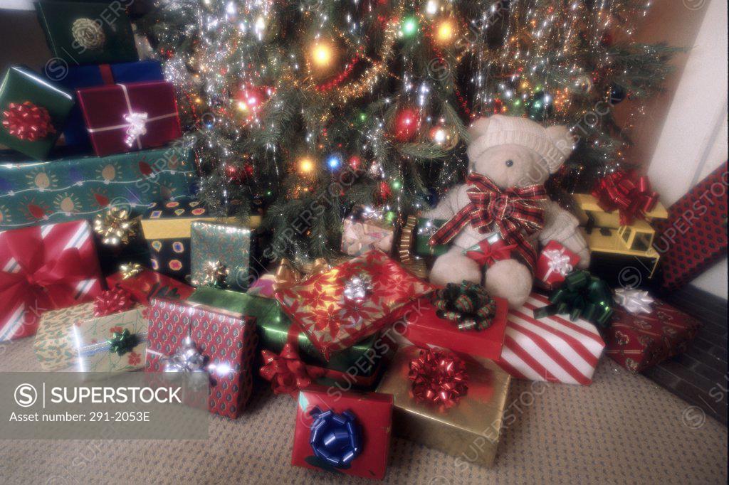 Stock Photo: 291-2053E Close-up of Christmas presents with a Christmas tree