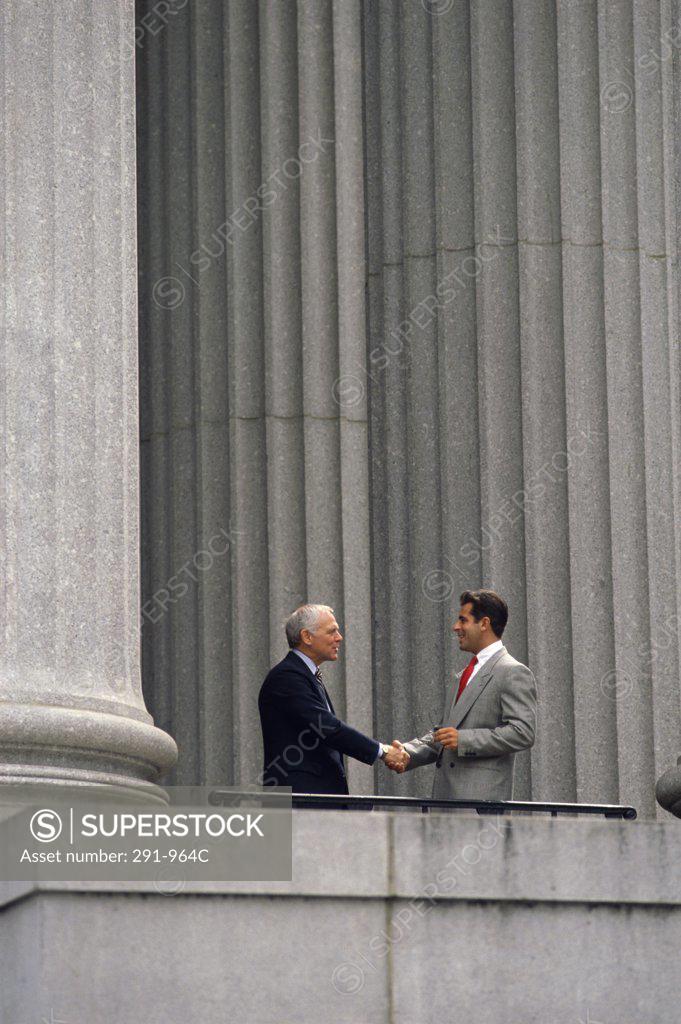 Stock Photo: 291-964C Two businessmen shaking hands