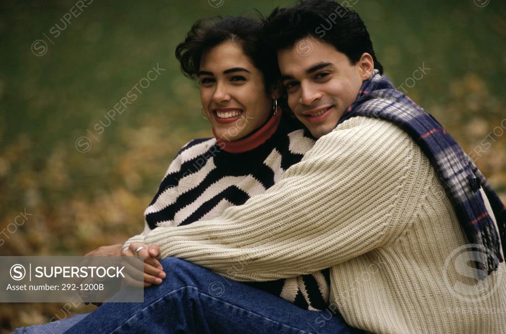 Stock Photo: 292-1200B Close-up of a young couple sitting and smiling