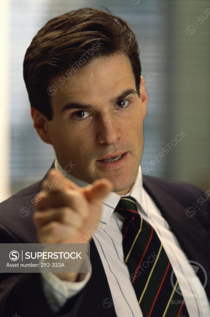 Stock Photo: 292-333A Portrait of a businessman pointing forward