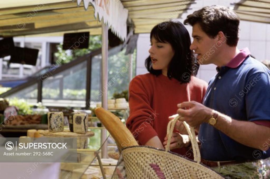 Stock Photo: 292-568C Young couple shopping in a store, Paris, France