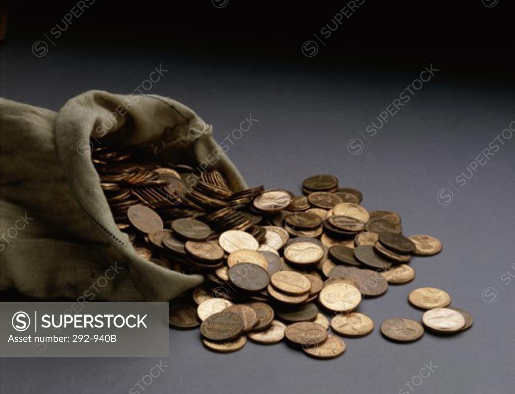 Stock Photo: 292-940B Close-up of coins spilling from a bag