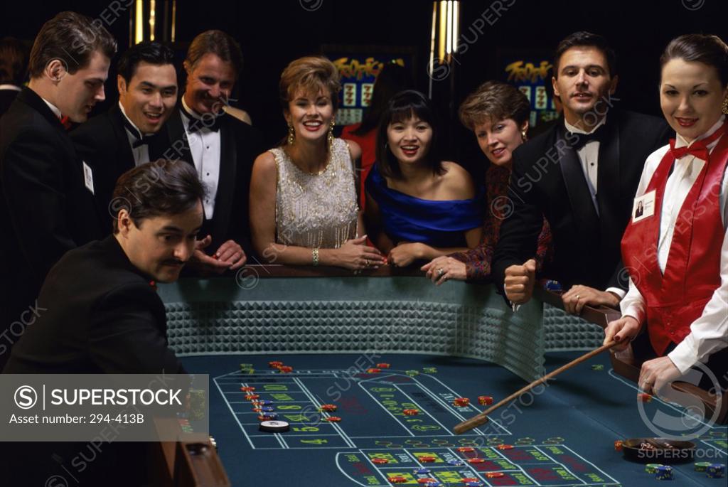 Stock Photo: 294-413B Group of people at a gambling table in a casino