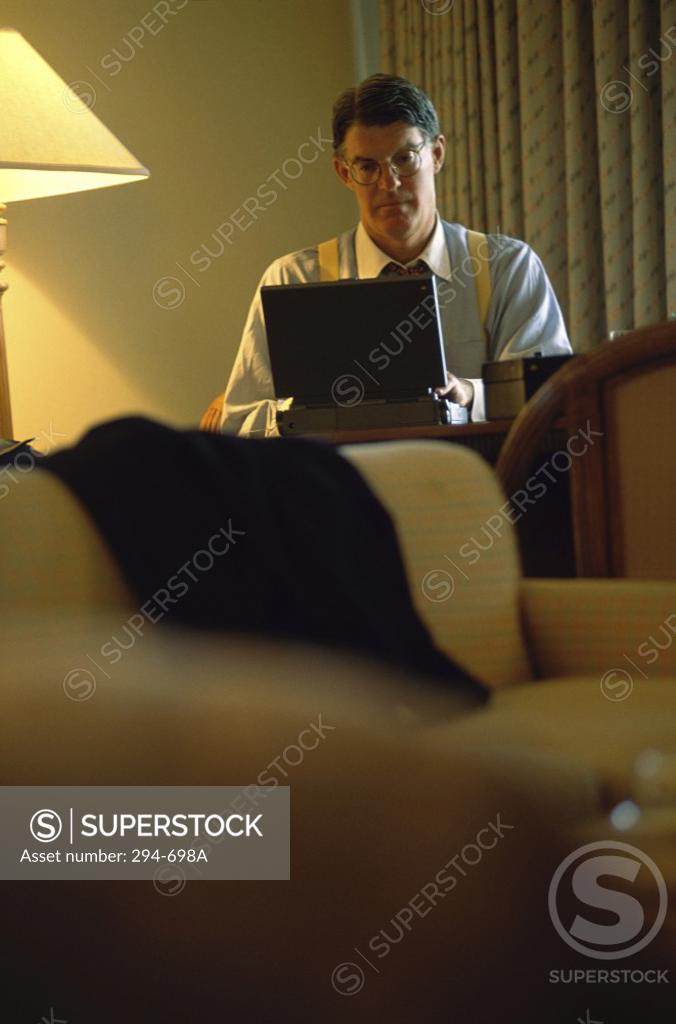Stock Photo: 294-698A Businessman using a laptop