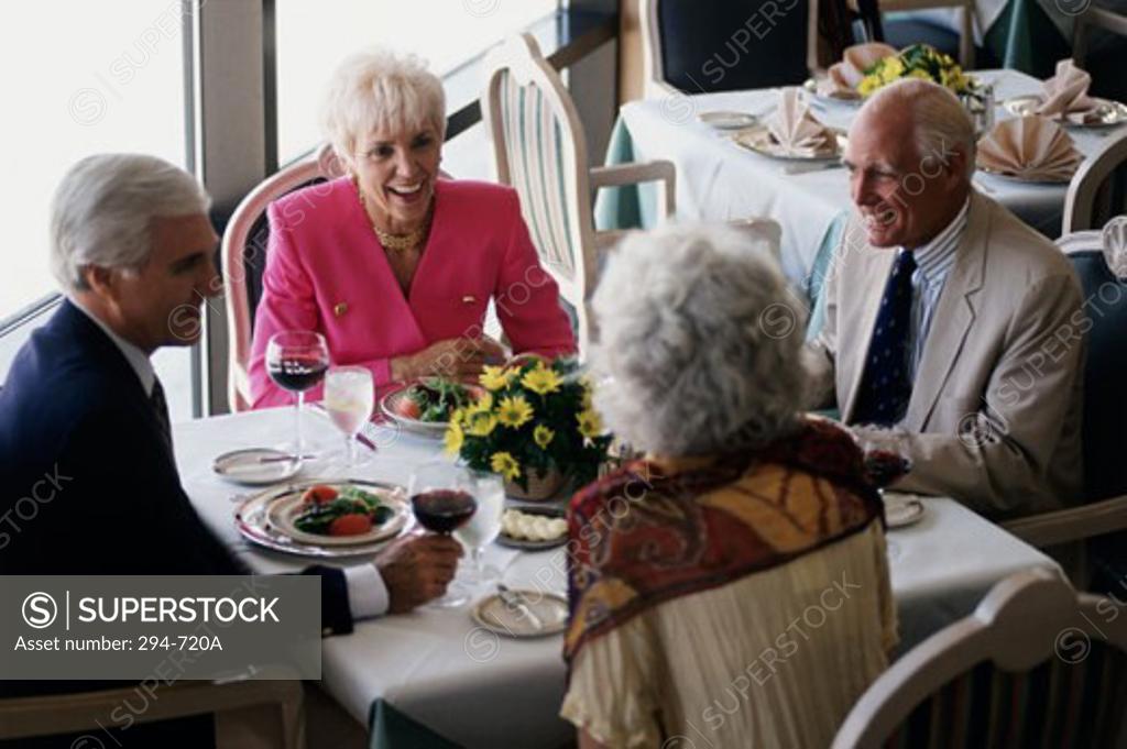 Stock Photo: 294-720A High angle view of two senior couples sitting in a restaurant
