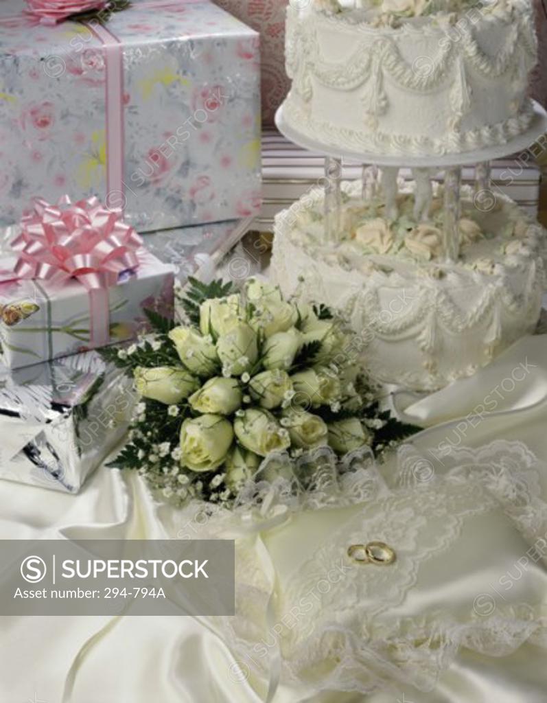 Stock Photo: 294-794A Cake with rings and gifts on a sheet