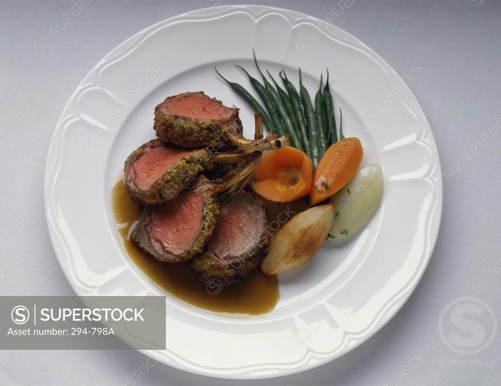 Stock Photo: 294-798A Close-up of lamb chops with vegetables served on a plate