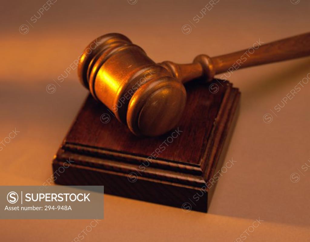 Stock Photo: 294-948A Close-up of a gavel on a wooden block
