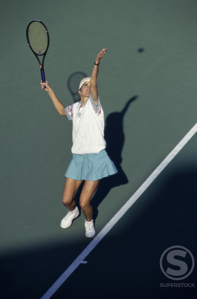 High angle view of a young woman playing tennis