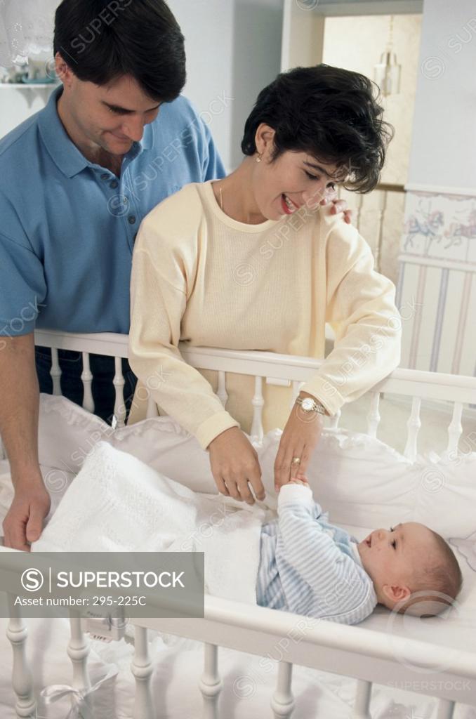 Stock Photo: 295-225C Young couple playing with their son