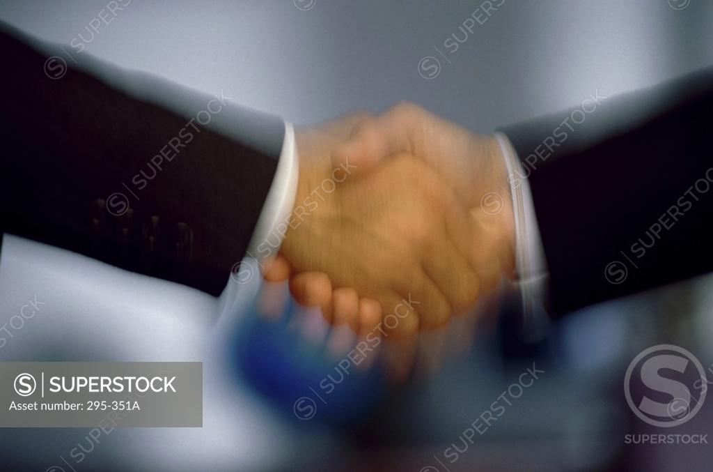 Stock Photo: 295-351A Two businessmen shaking hands