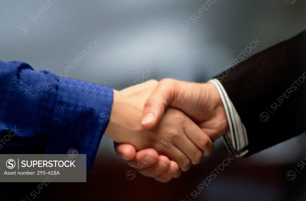 Stock Photo: 295-418A Close-up of two businessmen shaking hands