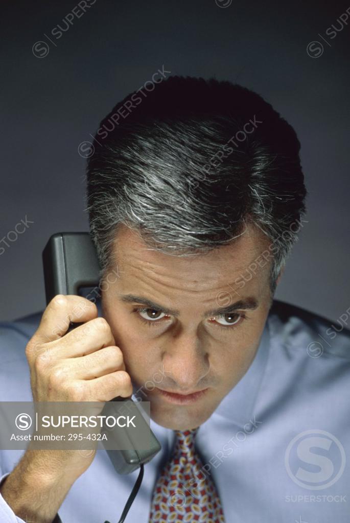 Stock Photo: 295-432A Close-up of a businessman talking on the telephone