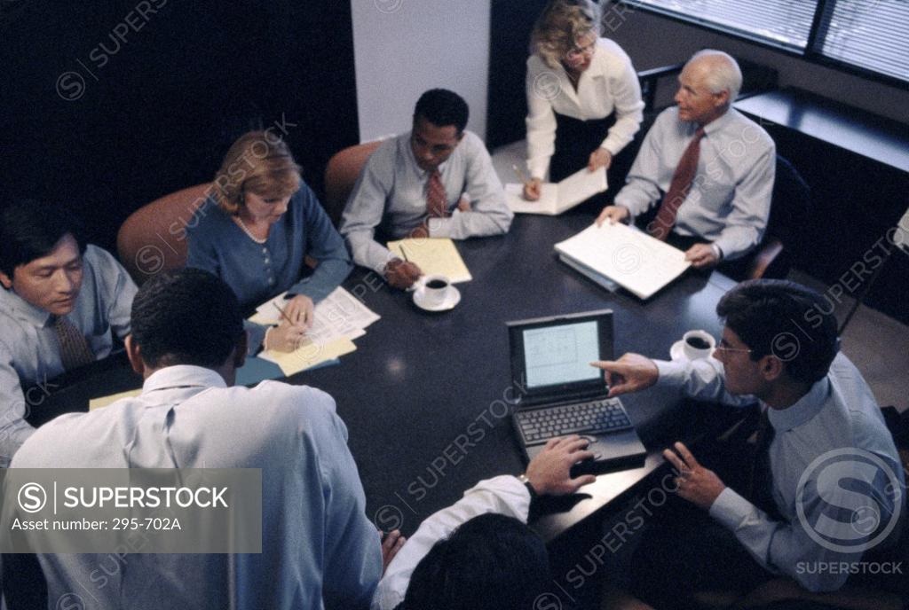 Stock Photo: 295-702A High angle view of business executives talking in a conference room