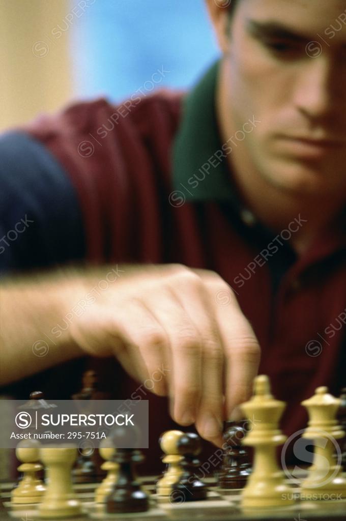 Stock Photo: 295-751A Young man playing chess