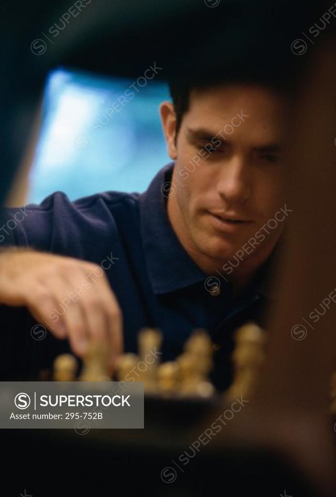 Stock Photo: 295-752B Young man playing chess
