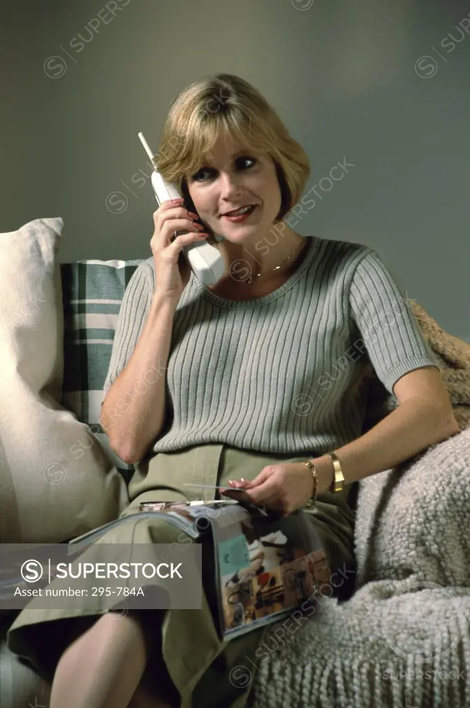 Mid adult woman shopping over a cordless phone