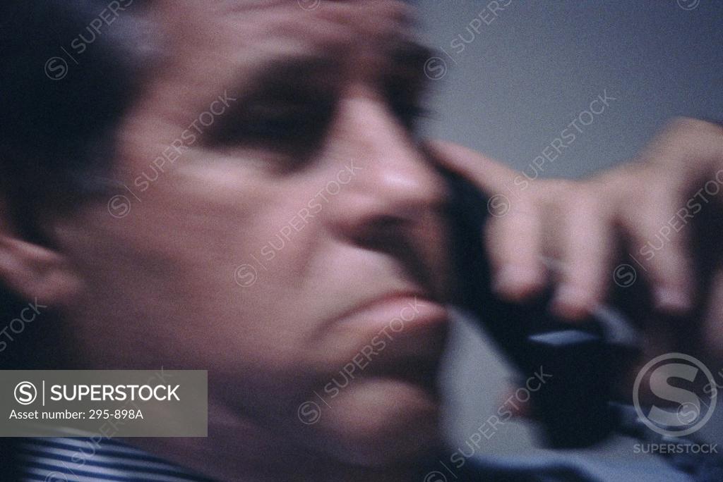Stock Photo: 295-898A Businessman talking on the telephone