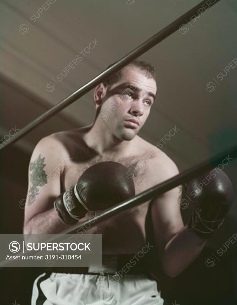 Stock Photo: 3191-310454 Close-up of a young man in a boxing ring