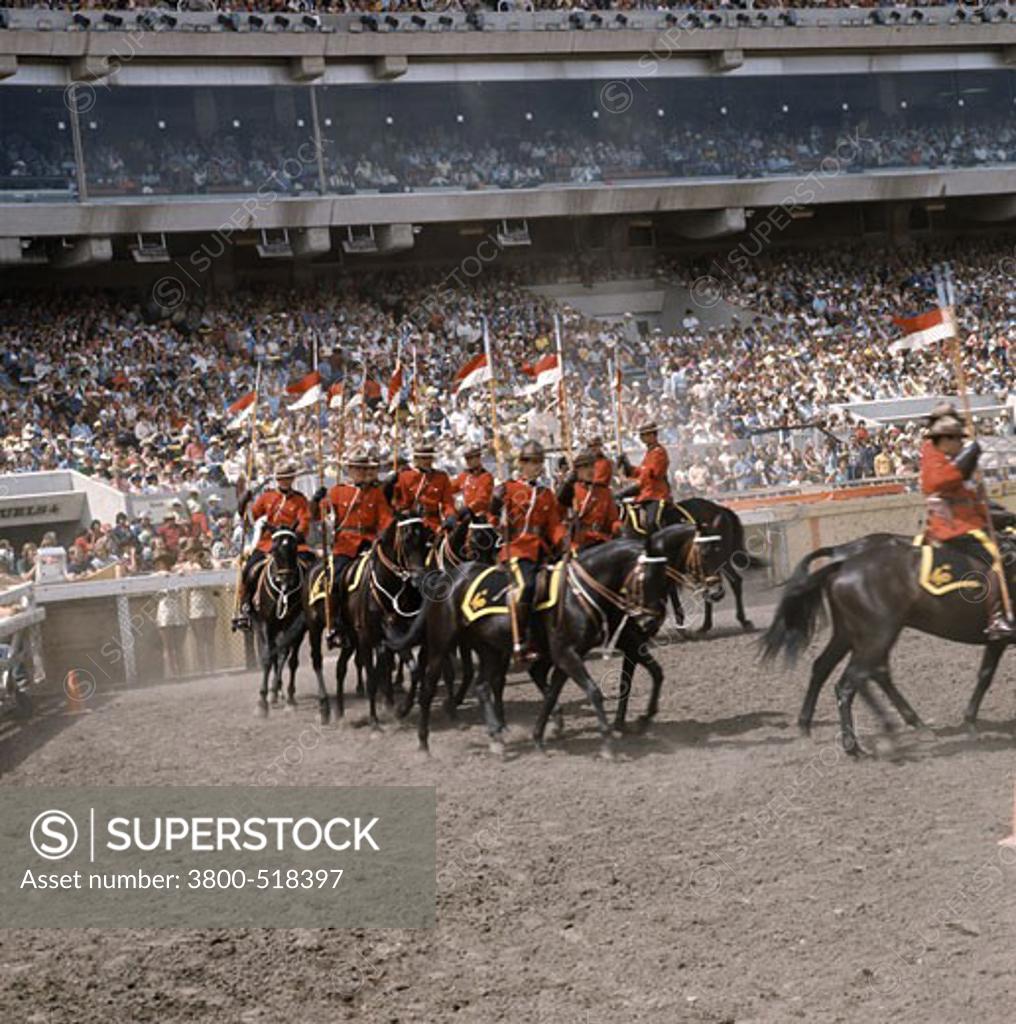 Stock Photo: 3800-518397 Canada, Alberta, Calgary, Royal Canadian Mounted Police Musical Ride, Mounties performing in ceremony
