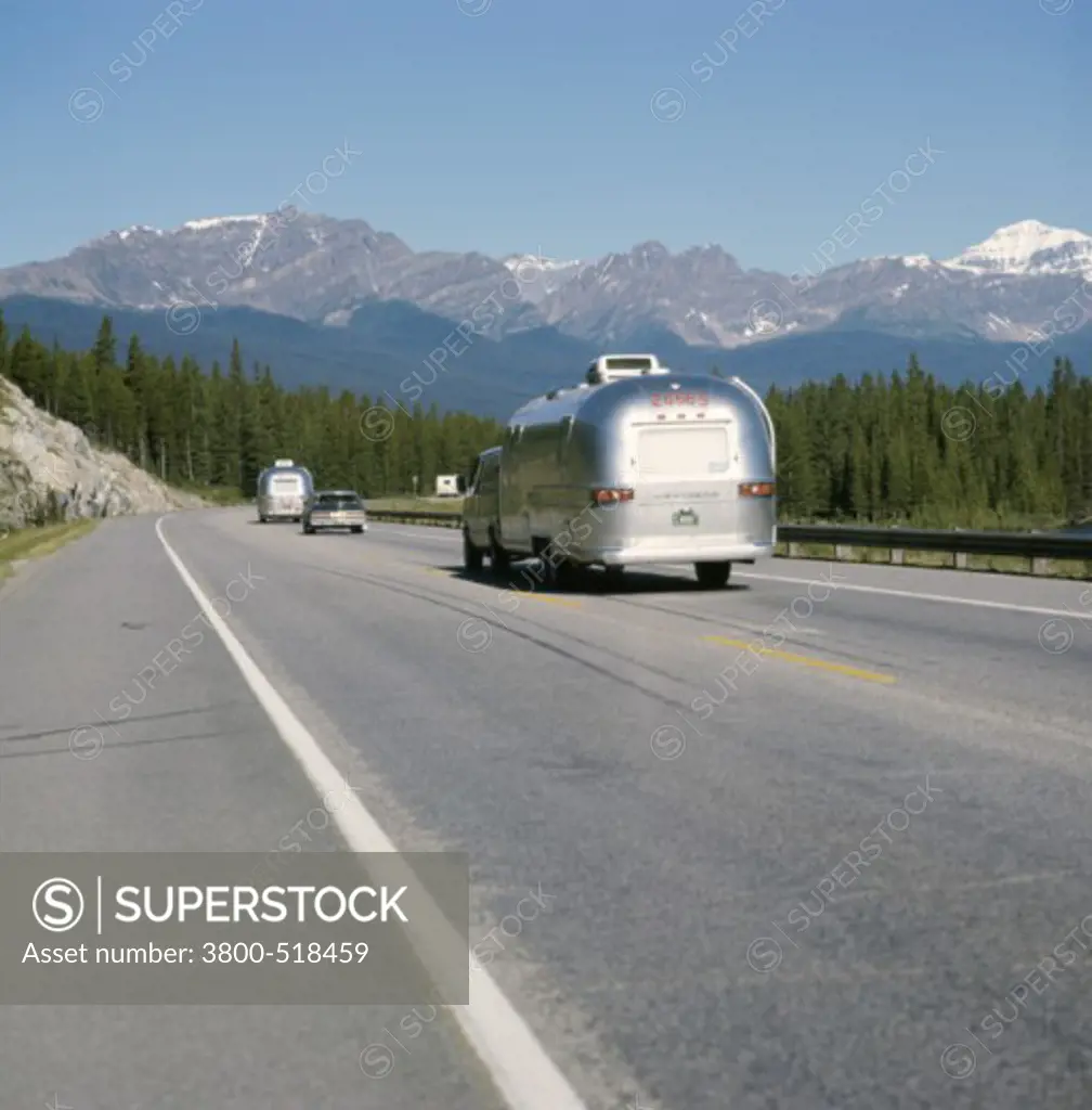 Rear view of traffic on a highway, Trans-Canada Highway, Eisenhower Junction, Banff National Park, Alberta, Canada