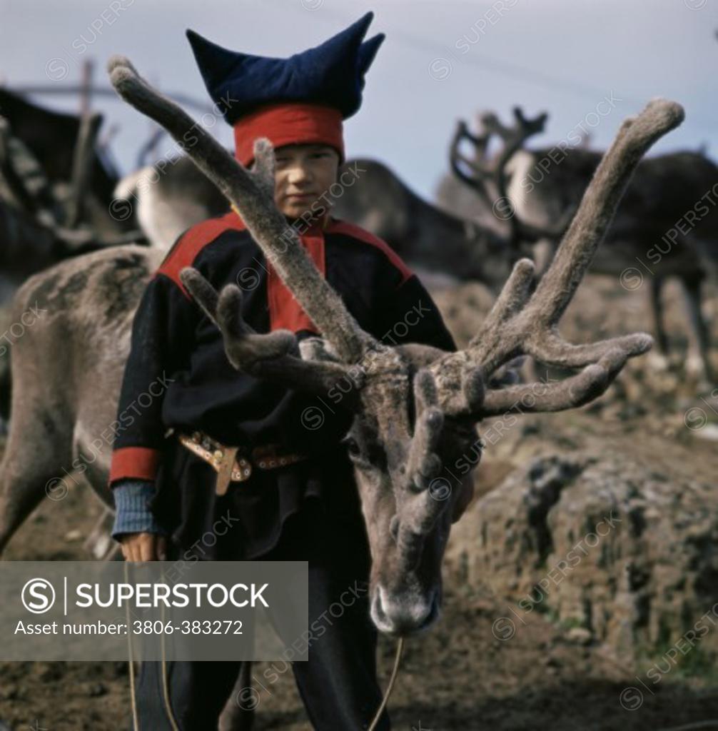 Stock Photo: 3806-383272 Sami Boy with Reindeer Honningsvag Norway