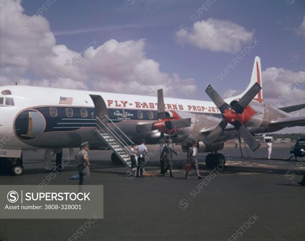 Stock Photo: 3808-328001 Passengers disembarking from an airplane, Lockheed Electra, Atlanta, Georgia, USA