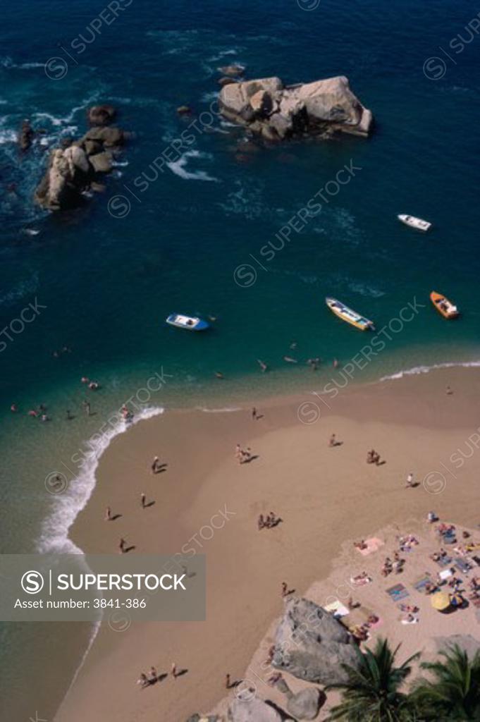 Stock Photo: 3841-386 Aerial view of tourists on the beach, Condesa Beach, Acapulco, Mexico