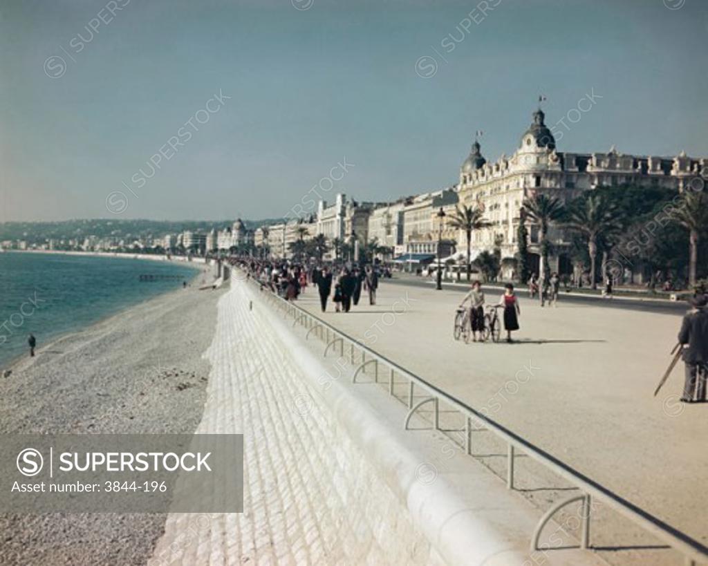 Stock Photo: 3844-196 Group of people walking on a pedestrian walkway, French Riviera, Nice, France