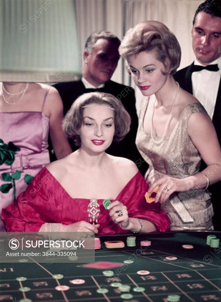 Stock Photo: 3844-335094 Five people at roulette table in casino