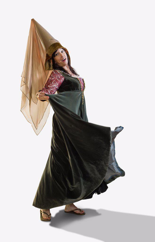 Full length portrait of a medieval Princess dancing and turning in circles, against white background