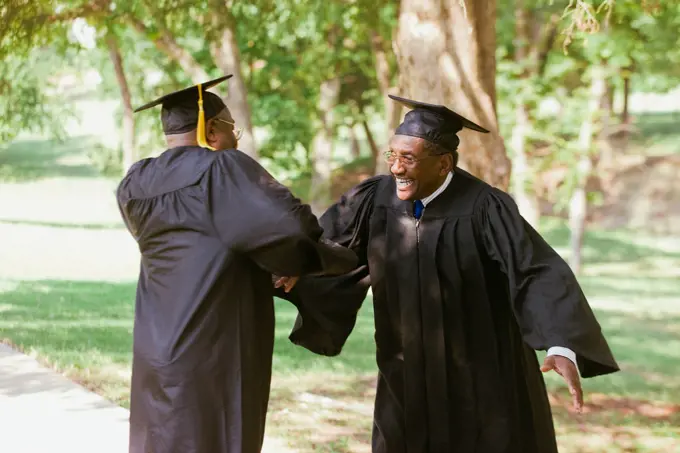 Senior African men in graduation caps and robes