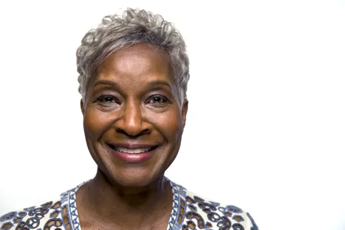 Portrait of older black woman looking at camera with smile