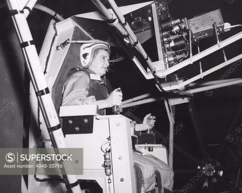 Jerrie Cobb, in astronaut training. She is learning to control the spin of a tumbling spacecraft. Cobb was the first female to pass all three phases of the Mercury Astronaut Program, but since she had not been a military test pilot, she and other women were dropped from the program. April 6, 1960.