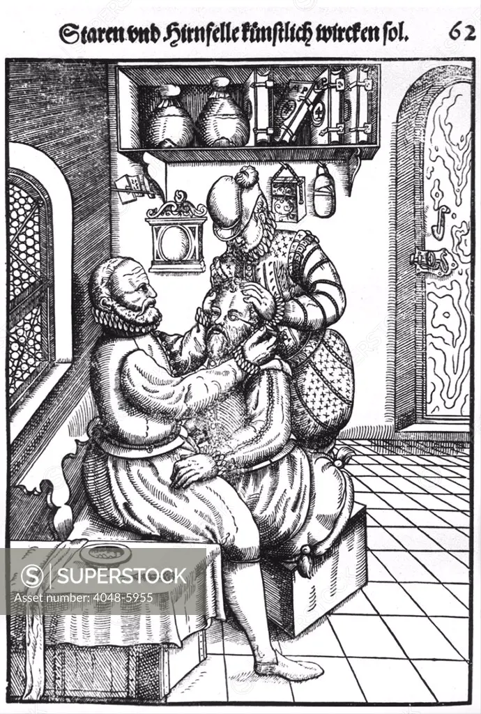 Patient having a cataract removed from his left eye by a surgeon whose assistant immobilizing the patient. Woodcut from OPHTHALMODOULEIA DAS IST AUGENDIENST, a 1583 book by Georg Bartisch (1535-1607).