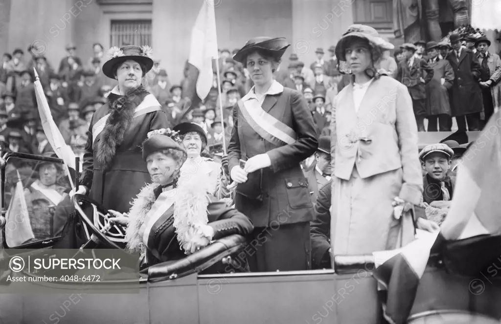 Prominent woman's suffrage advocates parade in an open car supporting the ratification of the 19th amendment granting women the right to vote in federal elections. Left to right: Mrs. W.L. Prendergast, Mrs. W.L. Colt, Doris Stevens, Alice Paul
