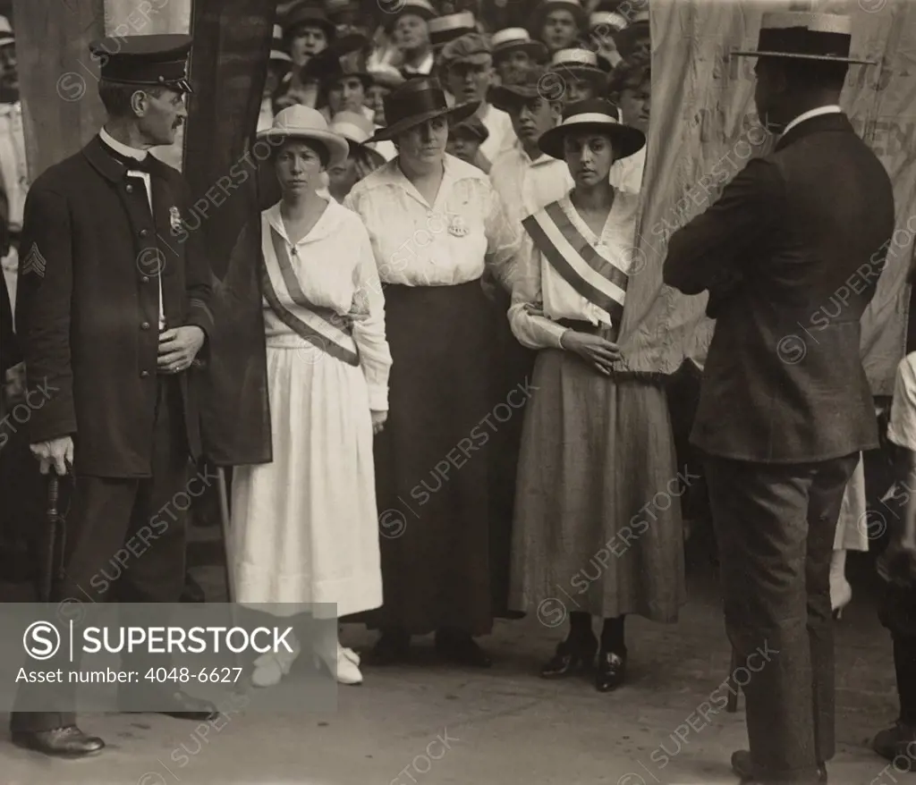 Suffragists Catherine Flanagan (left) and Madeleine Watson (right) of the militant National Woman's Party being arrested as they picket the White House East Gate. Both were sentenced to 30 days in Occoquan Workhouse, a prison where they were sometimes physically abused, forced if they refused to eat, and made to live in filthy conditions.