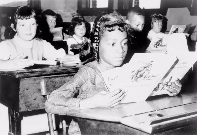 Ending de facto segregation in Boston. An African American child from Roxbury attending school in Jamaica Plain as part of 'Operation Exodus' which bused children to integrate Boston schools. Sept. 9, 1965.