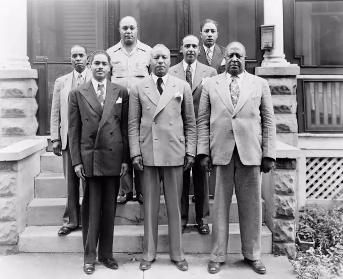 Brotherhood of Sleeping Car Porters group. President Asa Philip Randolph is in the center and Vice President Milton P. Webster is on his left. 1930s.