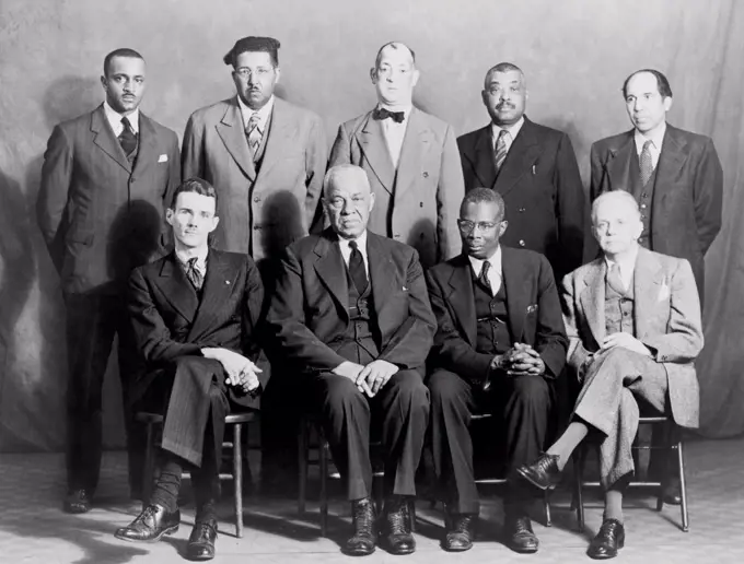 Five African American defendants and their NAACP counsel in Columbia, Tennessee 'Riot' case. Seated L-R: Maurice Weaver, Julius Blair, Alexander Looby, and Walter White. Standing left to right: James Martin, James Morton, Charles Blair, Saul Blair, and M.G. Ferguson. Ca. 1946.