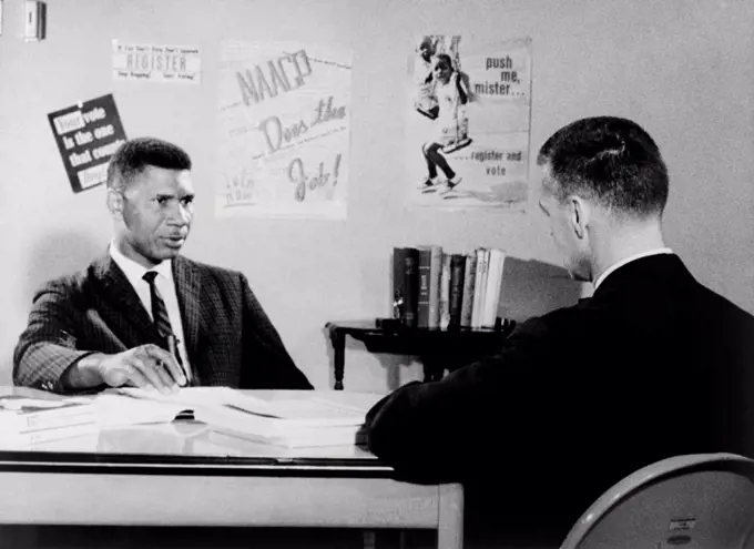 Medgar Evers, NAACP leader in Mississippi, being interviewed by Bill Peters. Peters (right) was an award-winning journalist who reported on the American civil rights movement. 1963.