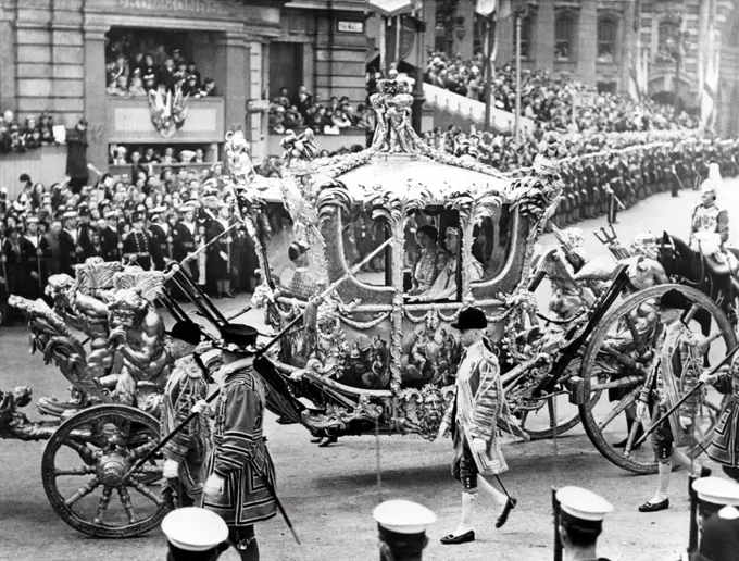 The magnificent state coach, King George VI and Queen Elizabeth I seated inside, passing through Trafalgar Square to Westminster Abbey, during the coronation procession. 5/18/37.