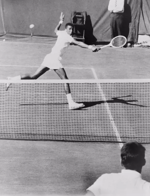 Arthur Ashe, (1943-1993), playing tennis at Forest Hills, N.Y. in 1964. He was the first African American to reach the highest levels of professional tennis.