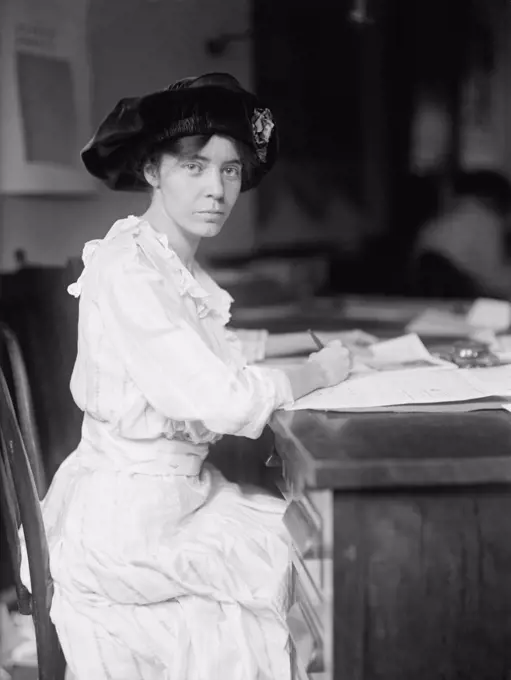 Alice Paul (1885-1977), militant American Suffragette leader and feminist at her desk in 1915. She was jailed three times in her protests for the ratification of the Nineteenth Amendment in 1920. In 1923 she drafted the first proposed equal rights amendment to the Constitution.